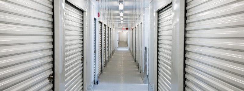 A perspective view down a corridor of storage units